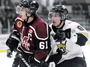 Chatham Maroons' Sean Myers, left, is checked by LaSalle Vipers' Blake Rutckyj in the third period Sunday at Memorial Arena. (MARK MALONE/The Daily News)