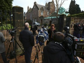 Members of the media gather outside the home of Cardinal Keith O'Brien in Edinburgh, Scotland February 25, 2013. (REUTERS/David Moir)