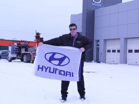 Mazda Timmins sales rep Mark Kinsman was waving the flag this week for the new Hyundai dealdership which is moving in to the 800 Riverside Drive location.