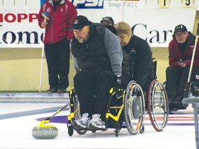 Kenora skip Wayne Ficek throws a stone while lead Denise Miault steadies his chair. The Ficek rink lost 9-7 in the final of the 2013 Northern Ontario Wheelchair Curling Championships.
GRACE PROTOPAPAS/Daily Miner and News