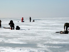 A familiar sight has returned to Mitchell's Bay, Ont. as the ice was dotted with people ice fishing on Monday, Jan. 7, 2013.  (QMI FILE PHOTO)