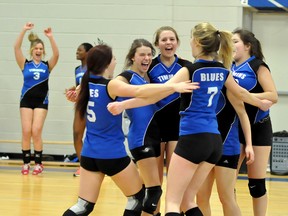 The Timmins High & Vocational Blues senior girls' volleyball triumphed over the Temiskaming District Secondary School Saints two sets to one, to earn the right to represent the North at the Ontario Federation of School Athletic Associations 'AA' volleyball final in early March. The Blues display emotion after winning one of their final points in the third set.