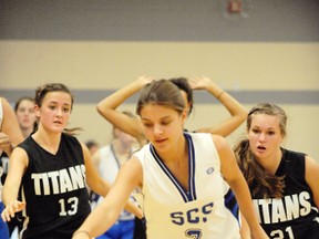 File Photo
Hailey Swyers from Simcoe Composite School is chased by members of the Holy Trinity Titans during this girls basketball game in 2012. The return of extracurricular activities such as sports are still up in the air despite the Ontario Secondary School Teachers Federation announcing they would return.