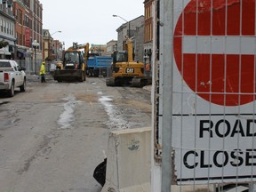 Workers begin the reconstruction of Princess Street between Bagot and King streets Monday afternoon. The reconstruction of the street and sewers underneath is expected to last until mid-June. (Elliot Ferguson The Whig-Standard)