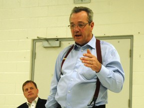 PC labour critic Randy Hillier makes an address during a town hall meeting in St. Thomas Monday evening while EML PC MPP Jeff Yurek watches. Hillier and Yurek hosted the town hall meeting at the St. Thomas Seniors Centre which dealt with mandatory WSIB coverage, a sore spot for many local contractors. NICK LYPACZEWSKI/ TIMES-JOURNAL/ QMI AGENCY