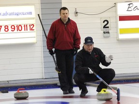 Skip Bob Degelman holds the broom and discusses strategy with his fellow players during the rinks opening game of the Paragon Ag Services Super League playoffs against the Russ Dickie rink on Thursday, February 21. Results from the opening round of the playoffs were not available however they continue on Thursday, February 28.