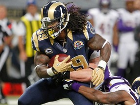 Rams running back Steven Jackson charges through the Vikings defence at the Edward Jones Dome in St. Louis, Miss., Dec. 16, 2012. (SARAH CONARD/Reuters)