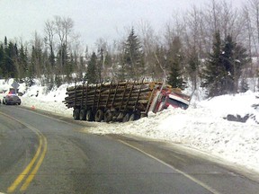 log truck in ditch