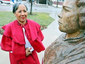 Brenda Travis, a Delta Sigma Theta Sorority sister, will be walking along Pennsylvania Avenue in Washington D.C. Sunday along with thousands of other members to mark the 100th anniversary of the 1913 Women's Suffrage March and in honour of her ancestors and women. The all black sorority's 22 founding members from Howard University, took part in the original walk protesting women should be allowed to vote in America. Buxton native Mary Ann Shadd Cary, right,  was one of the first black women law graduates from school. PHOTO TAKEN, Chatham, Ontario 
DIANA MARTIN/ THE CHATHAM DAILY NEWS/ QMI AGENCY