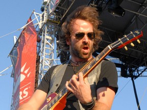 The Trews guitarist John Angus MacDonald fires the crowd up with a blistering solo at Bayfest 2009. MacDonald and his bandmates have twice played the festival and were considering a third go in 2013 before the festival was cancelled. THE OBSERVER/QMI AGENCY