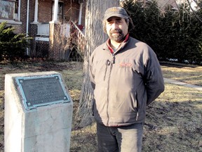 Gary Pryor, who owns two homes on Stanley Ave. in Chatham, Ont., just a few doors down from where human remains were found last August, stands beside a plaque recognizing the fact St. Paul's Anglican Church was located there from 1819 to 1869. Pryor said the plaque has been there for decades and he believes officials with the Municipality of Chatham-Kent knew a cemetery was part of the church. Photo taken Monday, Feb. 25, 2013 in Chatham, Ont. (ELLWOOD SHREVE/ THE CHATHAM DAILY NEWS/ QMI AGENCY)