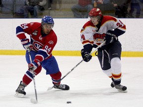 Kingston Voyageurs' Ludlow Harris tries to get by Wellington Dukes' Austin Broadhurst during Ontario Junior Hockey League action at the Invista Centre in November. The Voyageurs open a conference quarter-final playoff series against the Dukes in Kingston on Thursday night. (Whig-Standard file photo)