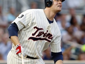 Justin Morneau of the Minnesota Twins is proud to suit up for Canada at the World Baseball Classic and is irked that Pittsburgh Pirates catcher Russell Martin would decline. (Reuters)
