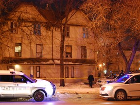 Police were investigating outside a rooming house on Balmoral Street on Tuesday, Feb. 26, 2013. (TESSA VANDERHART/Winnipeg Sun)