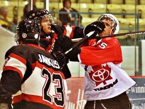 DARRYL G. SMART, The Expositor

Brantford's Chad Spurr and Orillia's Will Jones rough it up Tuesday at the civic centre during Game 3 of their best-of-seven Allan Cup Hockey semifinal series.