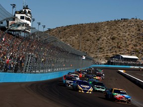 Kyle Busch leads the field to start the NASCAR Sprint Cup Series race at tricky Phoenix International Raceway last year. (Getty)
