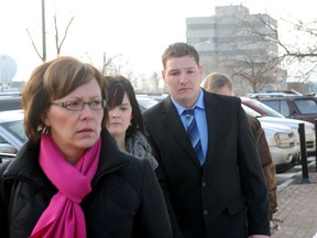 Brenden Holubowich arrives at Grande Prairie Provincial Court Tuesday with his mother Teresa Bateman (left) and friend Joleen Sams. Holubowich was convicted of five counts of dangerous driving in the collision that killed four Grande Prairie Composite students and injured a fifth in October 2011. On Wednesday he was sentenced to three years in prison and a three-year driving ban following his release. (Adam Jackson/Daily Herald-Tribune)