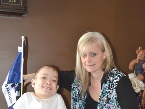 Lucas Braun with his mom Debbie Braun at their Whitechurch home, while Lucas recovers from his recent surgery to straighten out his bones due to the disease MPS.