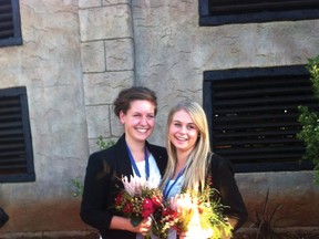 Allie Williams, left, poses with friend and Team Canada teammate Breanna Van Rooyen of Olds with their bronze medals in South Africa.