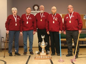 Airdrie 55+ Winter Games medallists, from left: Inger Grieve won silver in shuffleboard with partner Norma Weddow (not shown), Bob Bridger took gold in men’s hockey and Brian Wood, Karl Barfrieder and Roy Macfarlane were members of the gold-medal winning carpet bowling squad. They pose with the Lieutenant-Governor’s trophy, which Zone 2 won for being the most improved Zone at the Games, held Feb. 13-16 in Calgary.
CHRIS SIMNETT/AIRDRIE ECHO