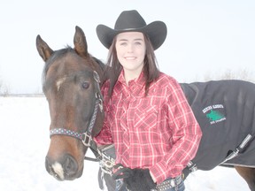 Submitted Photo

Raeanne Belzile poses for a picture with her horse Mia earlier in February. The 14 year-old is preparing for the upcoming 2013 reining season after a successful first year competing in 2012.