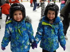 Jayla and Nichole Krawchuk, kindergarten students at St. Bernard's School, skated together at the Waterford Lions Club's 10th annual skate-a-thon at the Waterford Tricenturena on Saturday. (SARAH DOKTOR Simcoe Reformer)