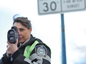 Airdrie Municipal Enforcement Peace Officer Annette Brown conducts radar enforcement on First Avenue in a school zone recently. 
PHOTO BY JAMES EMERY/AIRDRIE ECHO
