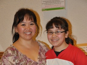 Grade 6 student Nui Nui Yun and her Hockey Mom