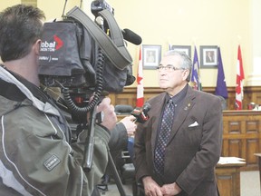 Mayor Bill Elliot is interviewed by a crew from Edmonton Global TV during a break in budget deliberations Feb. 19.