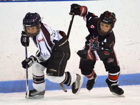 Tillsonburg's Michel Laundrie (left) races up the wing against Ingersoll Sunday in a 3-3 novice Southern Counties minor hockey playoff tie at the Kinsmen Memorial Arena. CHRIS ABBOTT/TILLSONBURG NEWS