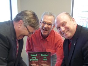 CTC board members Sean Adams and Ronald Bonneville join Caisse populaire general manager Denis Beadry in filling up the box for the Children's Treatment Centre.