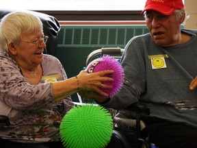Residents of the fourth floor continuing care unit got raucous Wednesday while playing hot potato during a Humour Therapy Program session. AMANDA RICHARDSON/TODAY STAFF