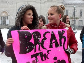 Anti-bullying Shyanne Conway Elliott (left) and Alexis Vallier, both 14 take part in a flash mob against bullying at Springer Market Square on Wednesday.
Ian MacAlpine The Whig-Standard