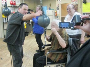 Submitted Photo

Rob Ferguson holds a speed bag for Denis Mallon, who at 92 got to relive his boxing past at the Black Eye Boxing Club.