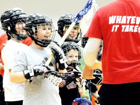 Players share a laugh with their instructor Jordan Durston during the Wallaceburg Red Devils' winter lacrosse camp held at St. Clair College's Thames Campus HealthPlex. MARK MALONE mark.malone@sunmedia.ca