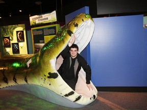 Student KC van Goozen, of College Boreal, sits in the mouth of a model of a Titanoboa snake featured in a new exhibit at Science North in Sudbury, ON. The snake, which is the largest one ever known, is part of The Science of Ripley's Believe It or Not!�, a joint production of Science North and Ripley Entertainment Inc. The exhibit opens March 2. See video at www.thesudburystar.com JOHN LAPPA/THE SUDBURY STAR/QMI AGENCY