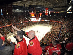 Calgary Flames fans get on their feet to celebrate after a goal during the team’s Feb. 13 game against the Dallas Stars. The Flames won 7-4. Corrie DiManno/ Banff Crag & Canyon