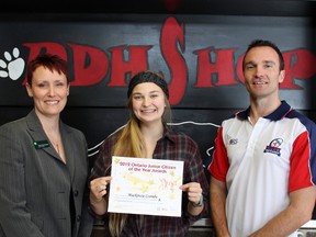 Mackenzie Coombe, 17, accepts a nomination certificate for the Ontario Junior Citizen of the Year Awards from Paris District High School teacher Steve Burroughs and sponsor TD Canada Trust representative Tanya Taylor-Gracey, branch manager in Paris on Monday, Feb. 25, 2013. MICHAEL PEELING/The Paris Star/QMI Agency