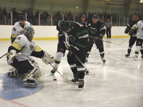 The Devon Barons (white) finished off the Rocky Mountain House Rams by a score of 14-4 in a game in Devon on Friday, Feb. 22. The Barons are now moving on to the final playoff round, facing off in game one against the Edson Ice this Saturday, Mar. 2 at the Dale Fisher Arena.
