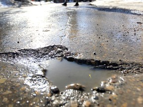 Pothole season in Winnipeg. (Chris Procaylo/Winnipeg Sun)