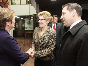 Sault Ste. Marie Mayor Debbie Amaroso (left) greets Ontario premier Kathleen Wynne Thursday as David Orazietti (right) looks on.