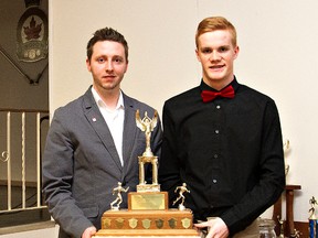 KARA WILSON, for The Expositor        

Riley Malcolm (right) is the winner of The Expositor Trophy as the Brantford Track and Field Club's athlete of the year. With him is coach Cory Currie.