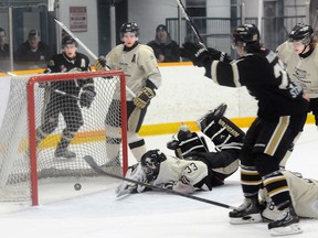 Cobourg Cougars' Mark MacAulay celebrates the eventual game winning goal in the Cougar's 6-4 win over the Trenton Golden Hawks in the opening game of their OJHL Northeast Conference quarter-final series Thursday night at the Community Gardens.