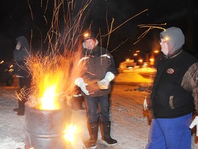 United Steelworkers Local 2020 members man a fire last night at the entrance to the Xstrata Nickel smelter complex in Falconbridge around 11 p.m. as talks continued with Xstrata Nickel. The union and the international miner have ratified a their contract by a vote of 75%.
GINO DONATO/THE SUDBURY STAR