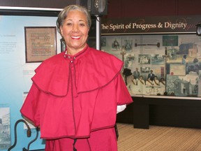 Brenda Travis is wearing period costume for the 100th anniversary of the 1913 Women's Suffrage March in Washington, D.C. A member of the Delta Sigma Theta sorority, Travis is walking the same path the sorority's 22 charter members did 100 years ago. The centennial march is taking place on March 3. This photo was taken at the Chatham-Kent Black Historical Museum.