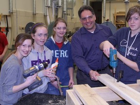Among those working on the nesting boxes were, from left to right, R.Ross Beattie students Cortny Marcaccini, Maggi-Lee Kerr, Kayla Lefevre, David Yaschyshyn of Xstrata and student Kate Floreani. Timmins Times LOCAL NEWS photo by Len Gillis.