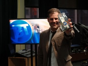 Breakfast Television host Ryan Jesperson holds up a swear jar at the City TV studios. All the proceeds from the jar will go towards the Youth Empowerment & Support Services (YESS). PHOTO SUPPILED