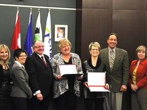 MLA for Stony Plain Ken Lemke (left) joins Queen Elizabeth II Diamond Jubilee Medal recipients Arlaine Monaghan (centre) and representative for Denny Andrews, who could not attend, Gloria Hill (right) during the presentation of the award at the Parkland County Council meeting Feb. 25.