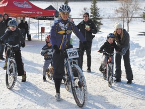 Canadian cyclocross national championship competitor Pepper Harlton took junior bikers for a quick spin at Voyageur Park, during the Devon Bicycle Association’s second annual Blizzard Bike Race on Saturday, Feb. 23. Cyclists of all ages, 55 in all, competed in several categories. Harlton would go on to win in the women’s 5-lap mountain bike race.