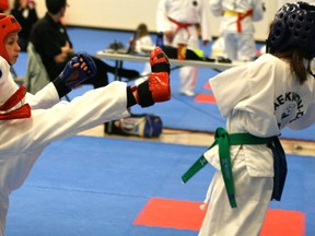 Julia Friesen from the Stony Plain Phoenix Taekwondo Club comes up just short with this kick during a sparring match at the weekend tournament. Photo by Gord Montgomery.